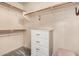 Walk-in closet with built-in shelving, drawers, and ample storage space at 16153 W Lisbon Ln, Surprise, AZ 85379
