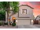 Charming two-story home featuring a spacious two-car garage, beautiful landscaping, and covered entry at 16153 W Lisbon Ln, Surprise, AZ 85379