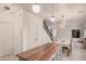 Bright kitchen with a wood-topped island, pendant lighting, and an adjacent dining area at 16153 W Lisbon Ln, Surprise, AZ 85379