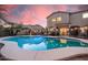 Sparkling pool featuring a large tanning ledge and fenced in area surrounded by desert landscaping at 16153 W Lisbon Ln, Surprise, AZ 85379