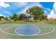 Community basketball court with vibrant blue and green coloring, with playground in background at 1633 E Lakeside Dr # 39, Gilbert, AZ 85234