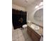 Bathroom featuring wood vanity with granite countertops and a decorative shower curtain at 1633 E Lakeside Dr # 39, Gilbert, AZ 85234