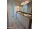 Bathroom featuring dual sinks with granite countertops and bright lighting at 1633 E Lakeside Dr # 39, Gilbert, AZ 85234