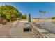 Sandy beach with lounge chairs, umbrellas, palm trees, and lake access at 1633 E Lakeside Dr # 39, Gilbert, AZ 85234
