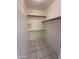 Spacious walk-in closet with shelving and tile flooring at 1633 E Lakeside Dr # 39, Gilbert, AZ 85234