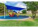 Playground with colorful slides, swings, and covered play area for enjoyment at 1633 E Lakeside Dr # 39, Gilbert, AZ 85234