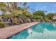 Stunning pool with multiple rock waterfalls and lush landscaping for a resort-style feel at 1633 E Lakeside Dr # 39, Gilbert, AZ 85234