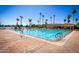 Beautiful pool with palm trees, cabana, and brick pool deck in a well-maintained community at 1633 E Lakeside Dr # 39, Gilbert, AZ 85234