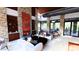 Comfortable community room with stone fireplace, modern seating, and expansive windows for natural light at 16932 W Desert Hollow Dr, Surprise, AZ 85387