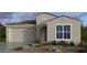 Charming single-story home featuring neutral tones, tile roofing and low-maintenance desert landscaping at 16932 W Desert Hollow Dr, Surprise, AZ 85387