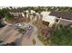 A modern home exterior with a landscaped entrance, driveway, and desert plants at 16932 W Desert Hollow Dr, Surprise, AZ 85387