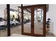 Spacious gym showcasing treadmills, elliptical machines and weight-training equipment and a view of a pool at 16932 W Desert Hollow Dr, Surprise, AZ 85387