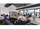 A well-equipped gym featuring modern exercise equipment, weights, and an open layout with views of the pool at 16932 W Desert Hollow Dr, Surprise, AZ 85387