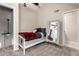 Upstairs bedroom featuring a ceiling fan, dormer window, and full-length mirror at 19820 N 13Th Ave # 255, Phoenix, AZ 85027
