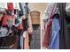 Walk-in closet well-stocked with clothes and storage at 19820 N 13Th Ave # 255, Phoenix, AZ 85027