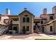 Charming condo building with red tile roof and inviting entryways under a clear blue sky at 19820 N 13Th Ave # 255, Phoenix, AZ 85027