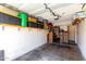 Attached garage with shelving for storage and painted walls at 19820 N 13Th Ave # 255, Phoenix, AZ 85027