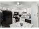 Well-lit kitchen features white cabinets, stainless steel appliances, and a granite-top island at 19820 N 13Th Ave # 255, Phoenix, AZ 85027