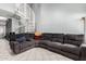 Open living area featuring a white spiral staircase and roomy, relaxing sectional sofa at 19820 N 13Th Ave # 255, Phoenix, AZ 85027