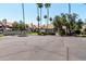 Exterior shot of a paved parking lot with community mailboxes and palm tree landscaping at 19820 N 13Th Ave # 255, Phoenix, AZ 85027
