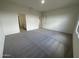 Spacious bedroom features neutral carpeting and an ensuite bathroom, providing comfort and convenience at 2025 E Bucking Bronco Dr, San Tan Valley, AZ 85140