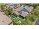 Aerial view of the house showing the swimming pool, lawn, desert landscaping and solar panels at 21014 W Cora Vista --, Buckeye, AZ 85396