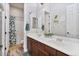 Bright bathroom with a double sink vanity, decorative mirrors, and a shower and tub combo at 21014 W Cora Vista --, Buckeye, AZ 85396