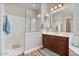 A sleek bathroom featuring a glass shower, and dark wood vanity with sink at 21014 W Cora Vista --, Buckeye, AZ 85396