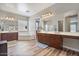 Spacious bathroom featuring a soaking tub, dual sinks, vanity, and wood-look floors at 21014 W Cora Vista --, Buckeye, AZ 85396