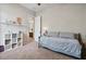 Comfortable bedroom featuring neutral walls, carpeted floors, and white storage shelves at 21014 W Cora Vista --, Buckeye, AZ 85396