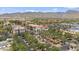Aerial view showcasing a vibrant commercial area with manicured landscaping, fountain and palm trees at 21014 W Cora Vista --, Buckeye, AZ 85396