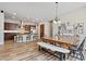 Inviting dining area with wood floors, chandelier, and views into the kitchen, offering a perfect space for meals at 21014 W Cora Vista --, Buckeye, AZ 85396