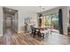 Dining area features a wooden table set, a sliding glass door to the backyard, and hardwood floors at 21014 W Cora Vista --, Buckeye, AZ 85396