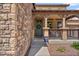 Charming front porch with stone accents, providing a cozy and inviting entry to the home at 21014 W Cora Vista --, Buckeye, AZ 85396