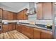 Kitchen has granite counters, stainless appliances, hardwood floors, and stylish wooden cabinetry at 21014 W Cora Vista --, Buckeye, AZ 85396