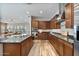 Well-equipped kitchen with stainless appliances, granite countertops, wood cabinets, and hardwood floors at 21014 W Cora Vista --, Buckeye, AZ 85396