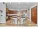 Spacious kitchen featuring a central island, stainless steel appliances, wooden cabinetry, and hardwood flooring at 21014 W Cora Vista --, Buckeye, AZ 85396