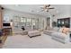 Comfortable living room featuring plush sofas, ceiling fan, and a soft carpet, ideal for relaxation and socializing at 21014 W Cora Vista --, Buckeye, AZ 85396