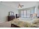 Comfortable main bedroom with soft carpet, ceiling fan, and ample closet space, providing storage at 21014 W Cora Vista --, Buckeye, AZ 85396
