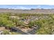 Scenic neighborhood view with lush trees and mountain backdrop, showcasing a peaceful residential community at 21014 W Cora Vista --, Buckeye, AZ 85396