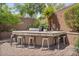 Outdoor kitchen bar features a built-in grill and seating in a well-landscaped backyard setting at 21014 W Cora Vista --, Buckeye, AZ 85396