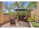 Charming patio area with brick pavers, seating, and lush greenery at 21014 W Cora Vista --, Buckeye, AZ 85396