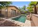 Backyard pool has a fenced perimeter, mature trees, and serene landscaping, ideal for hot days at 21014 W Cora Vista --, Buckeye, AZ 85396