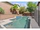 Private backyard oasis with a sparkling pool, tranquil water feature, and lush greenery perfect for relaxation at 21014 W Cora Vista --, Buckeye, AZ 85396