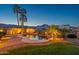 Custom designed backyard with a pool and patio area perfect for entertaining guests and enjoying the scenic views at 21104 W Sage Hill Rd, Buckeye, AZ 85396