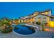 Gorgeous backyard pool and patio area, perfect for outdoor living and entertaining with professional landscape and custom lighting at 21104 W Sage Hill Rd, Buckeye, AZ 85396
