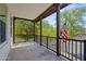 A covered balcony with black railing offers outdoor space and views of trees and neighborhood at 21104 W Sage Hill Rd, Buckeye, AZ 85396