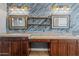 Bathroom featuring dual sinks and decorative lighting fixtures and accent wall at 21104 W Sage Hill Rd, Buckeye, AZ 85396