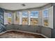Bright bedroom featuring plantation shutters and an expansive view of desert landscape at 21104 W Sage Hill Rd, Buckeye, AZ 85396