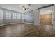 A spacious living room featuring tile floors, ample natural light, and stairs to an upper level at 21104 W Sage Hill Rd, Buckeye, AZ 85396